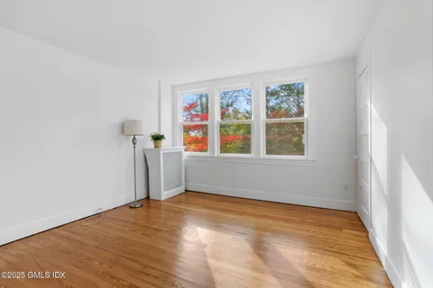 a spacious bedroom with a bed and couch