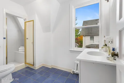 a bedroom with bed and window