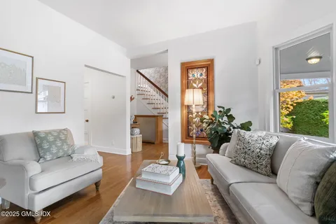 a view of a dining room with furniture wooden floor and chandelier