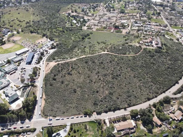 an aerial view of residential house and green space