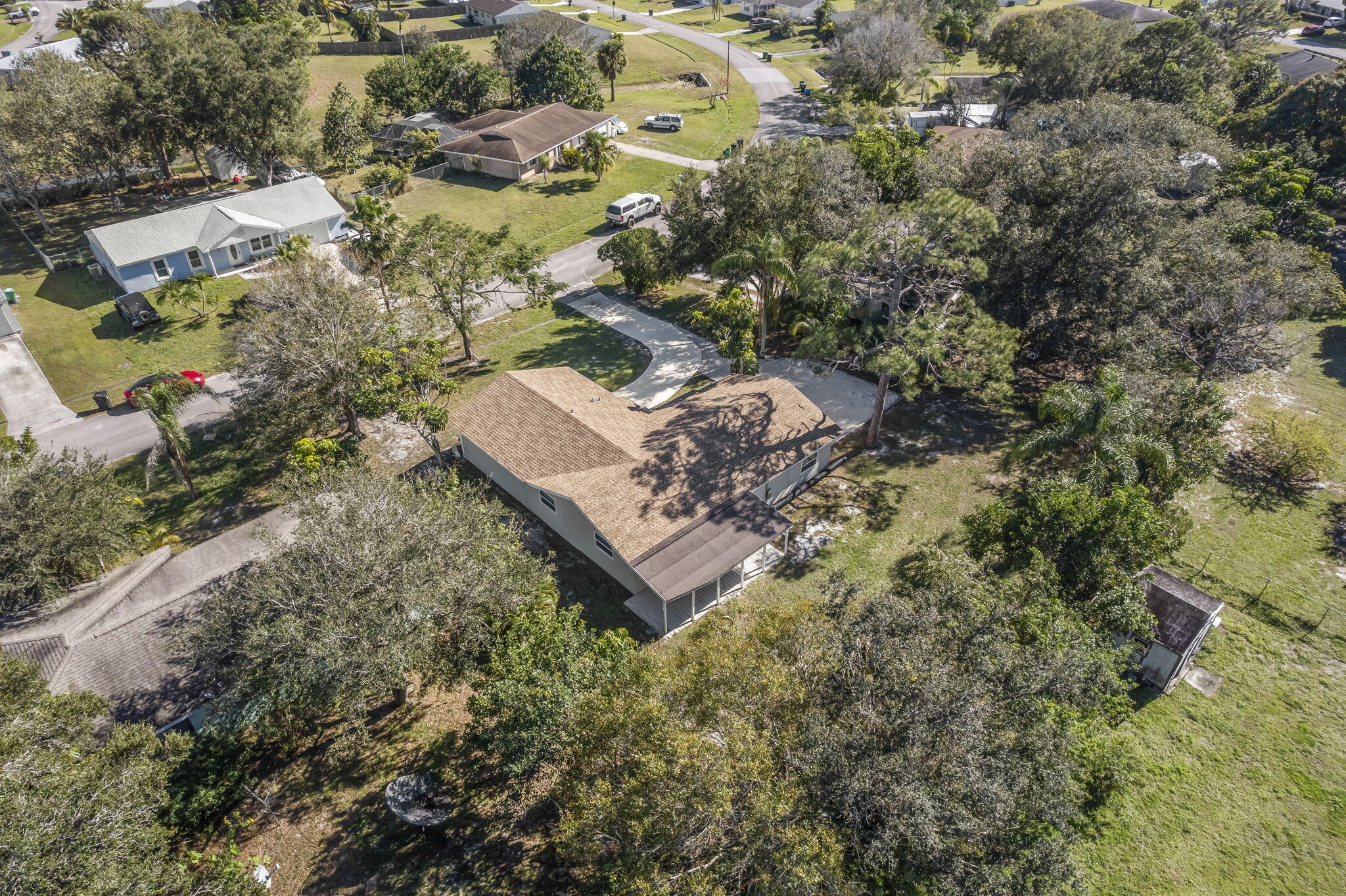 333 Southwest Kentwood Road Port St. Lucie, FL 34953 - Photo 20 of 22 an aerial view of a house with a yard
