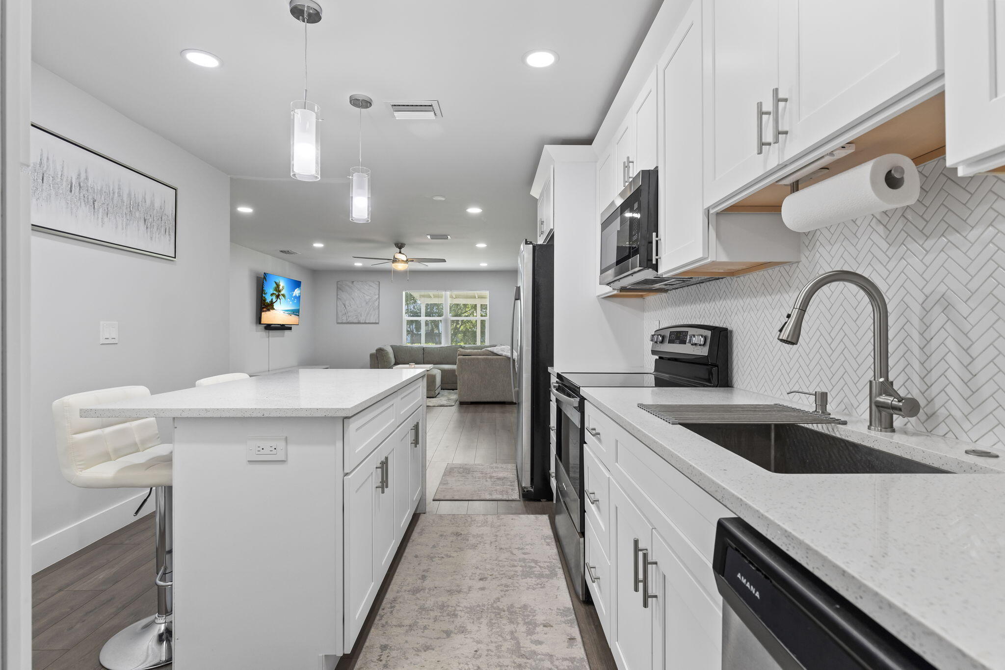 333 Southwest Kentwood Road Port St. Lucie, FL 34953 - Photo 4 of 22 a kitchen with a sink and a refrigerator