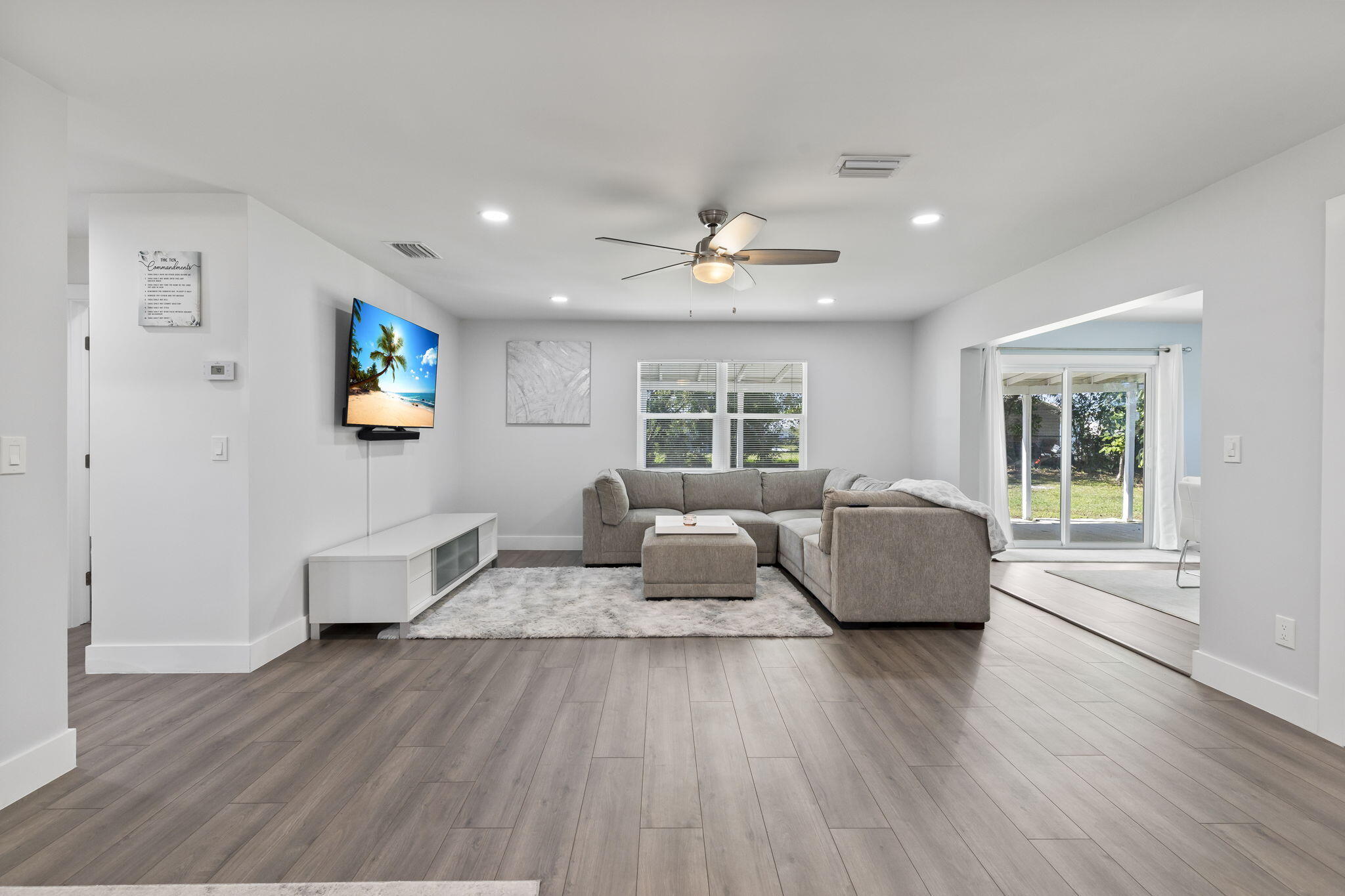 333 Southwest Kentwood Road Port St. Lucie, FL 34953 - Photo 7 of 22 a living room with furniture and a wooden floor