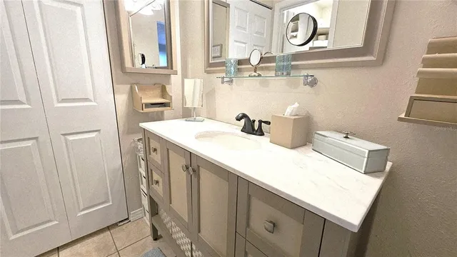 a bathroom with a sink and a mirror