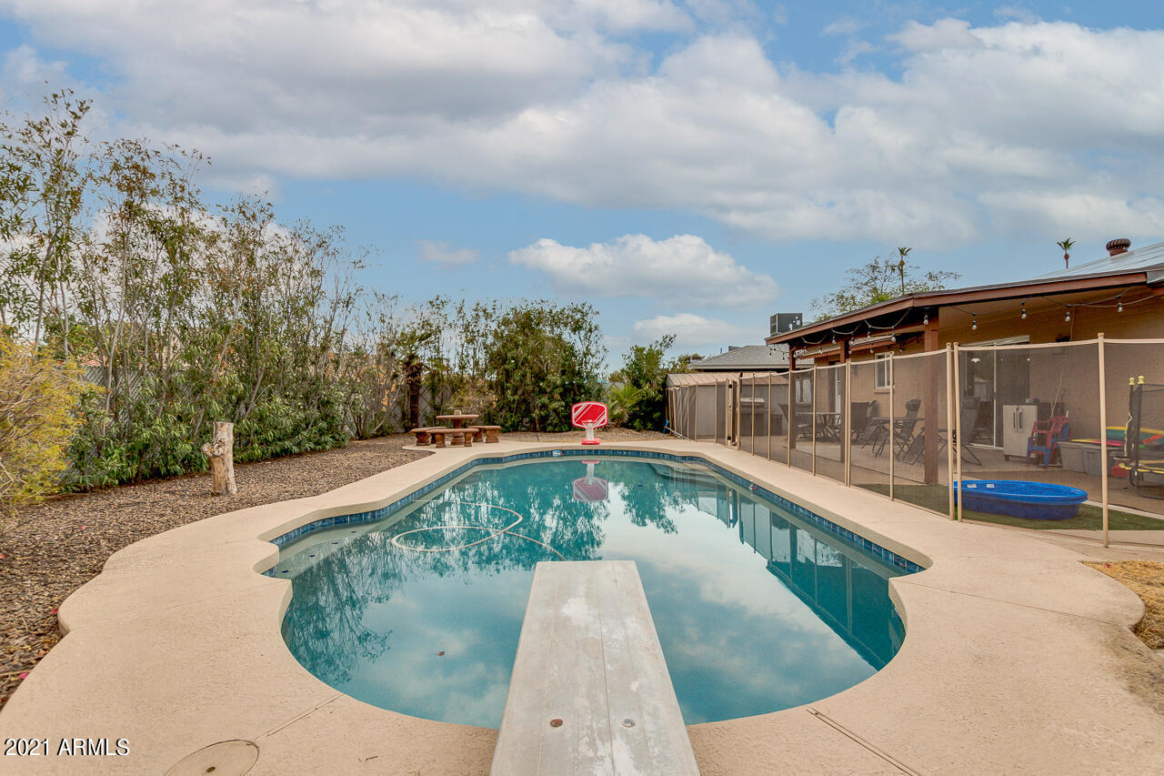 4215 West Dailey Street Phoenix, AZ 85053 - Photo 31 of 32 a view of swimming pool with a yard
