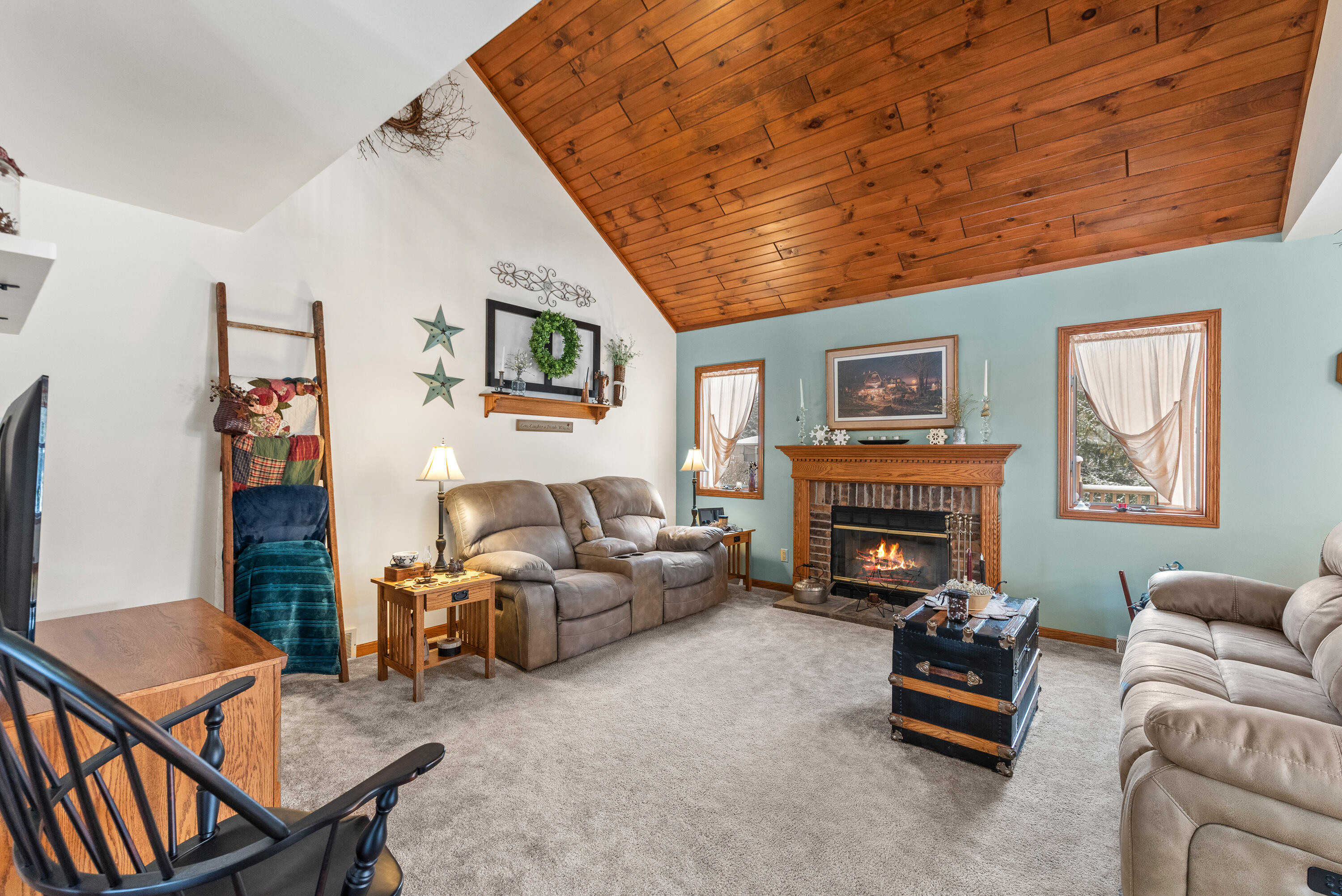 W1072 Hilltop Road Rubicon, WI 53078 - Photo 11 of 51 This room offers vaulted wooded plank ceiling & natural fireplace.