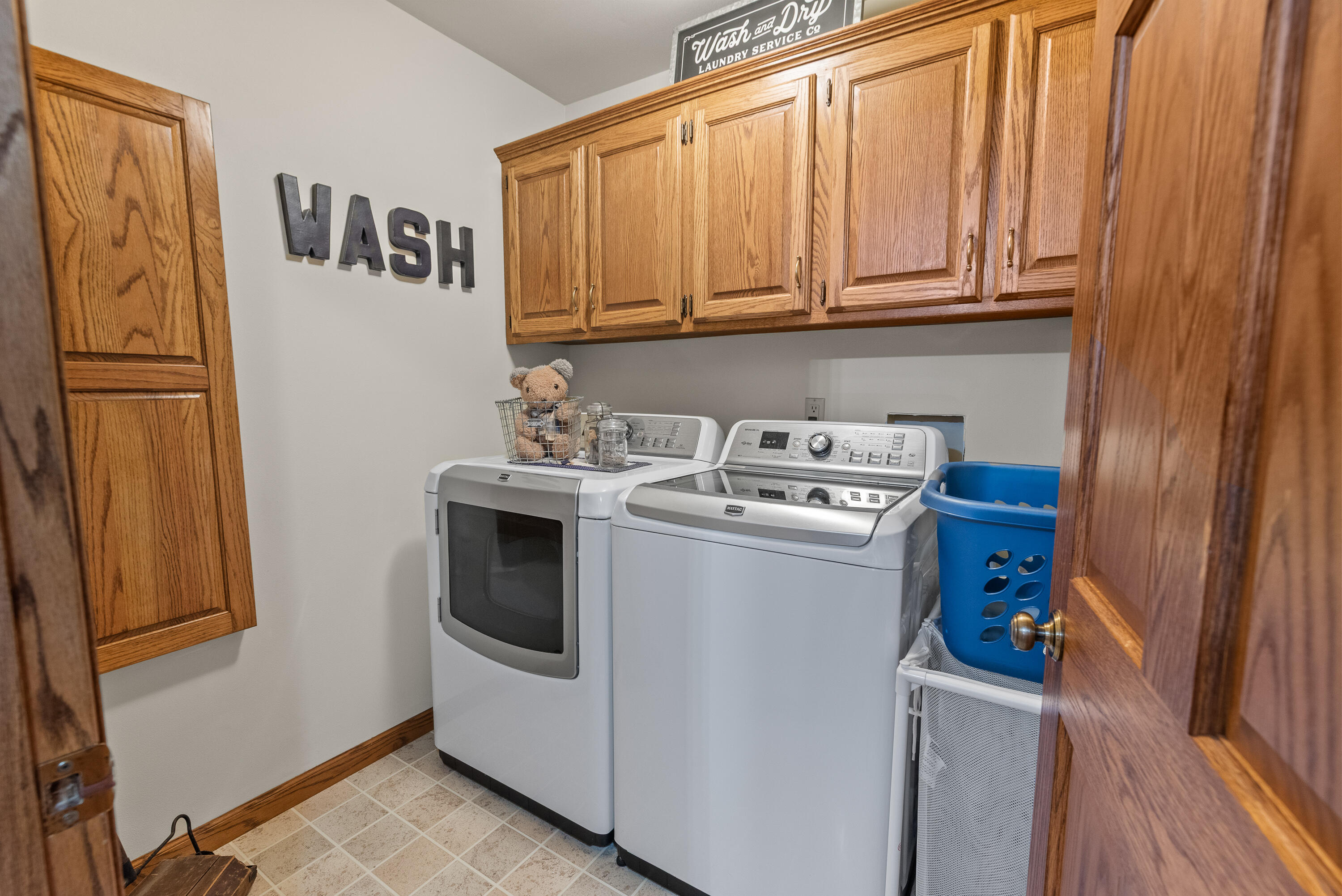 W1072 Hilltop Road Rubicon, WI 53078 - Photo 18 of 51 This is a great room, conveniently located just off garage area with utility sink & extra cabinetry