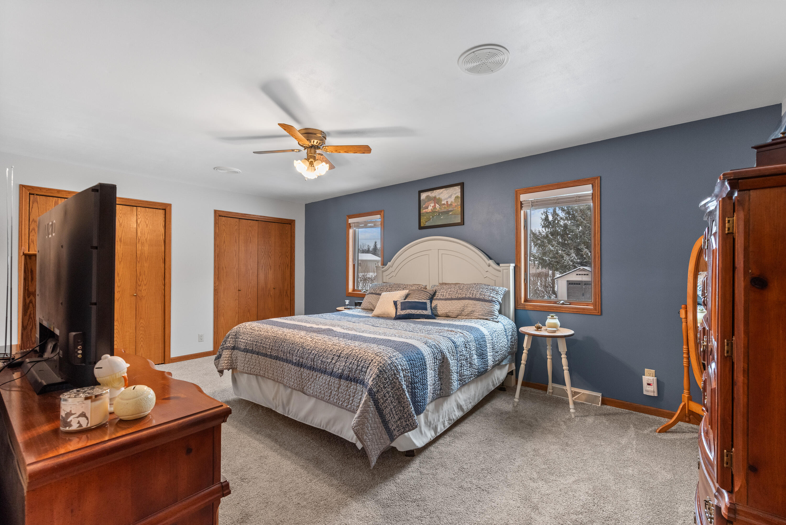 W1072 Hilltop Road Rubicon, WI 53078 - Photo 19 of 51 Primary bedroom is located on the main level with dual closets & private master suite.