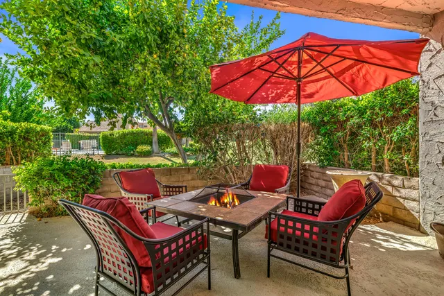 a kitchen with a sink and chairs