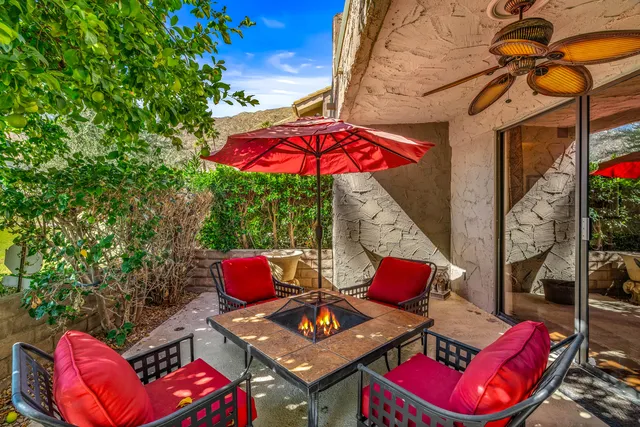 a kitchen with granite countertop a stove sink and microwave