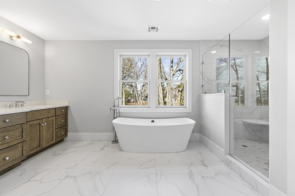 78 Morningside Road Needham, MA 02492 - Photo 19 of 38 a spacious bathroom with a bathtub shower sink mirror and toilet