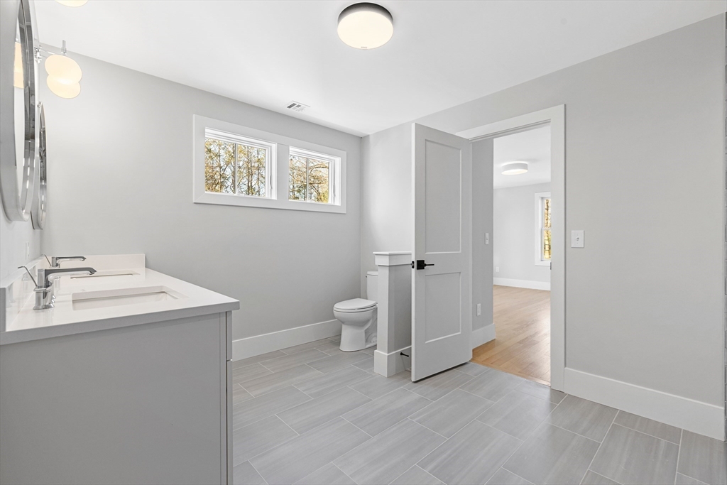78 Morningside Road Needham, MA 02492 - Photo 23 of 38 a view of bathroom with a sink mirror and toilet