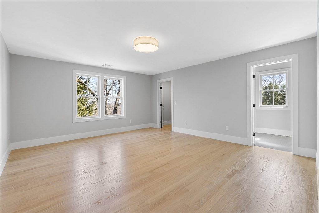 78 Morningside Road Needham, MA 02492 - Photo 25 of 38 an empty room with wooden floor and windows