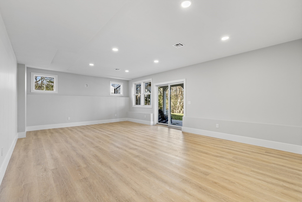 78 Morningside Road Needham, MA 02492 - Photo 28 of 38 a view of an empty room with wooden floor and a window