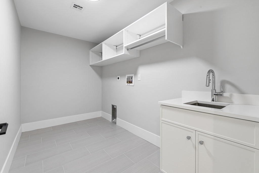 78 Morningside Road Needham, MA 02492 - Photo 29 of 38 a kitchen with a sink and cabinets