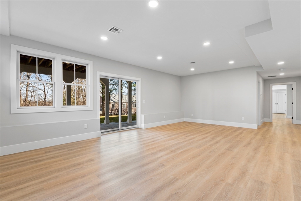 78 Morningside Road Needham, MA 02492 - Photo 30 of 38 a view of an empty room with wooden floor and windows