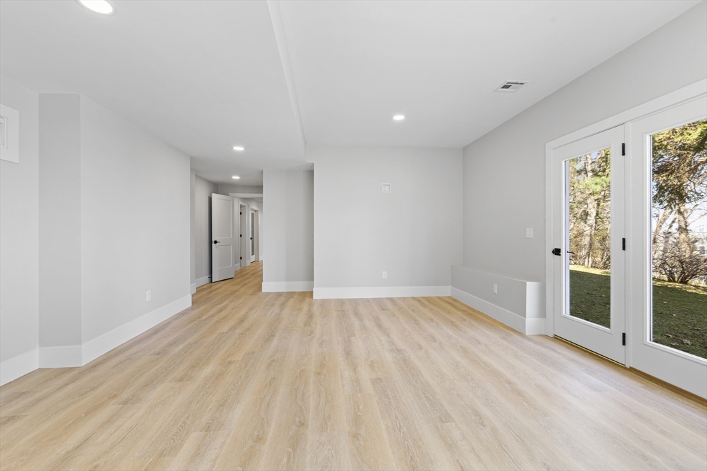 78 Morningside Road Needham, MA 02492 - Photo 32 of 38 a view of empty room with wooden floor and fan