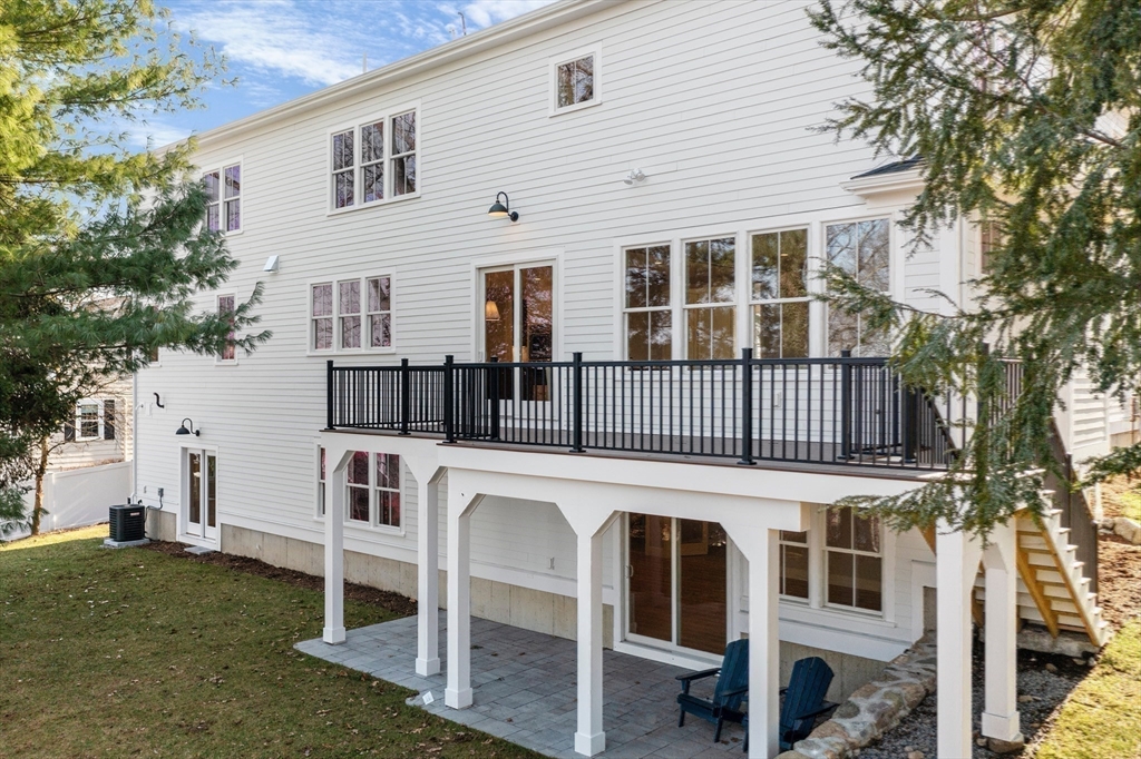 78 Morningside Road Needham, MA 02492 - Photo 35 of 38 a view of a house with a deck and a large tree