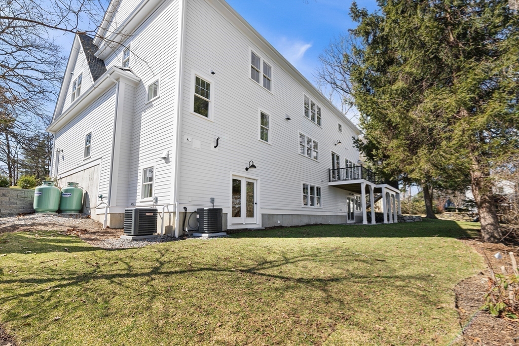 78 Morningside Road Needham, MA 02492 - Photo 36 of 38 a view of a white house with a yard