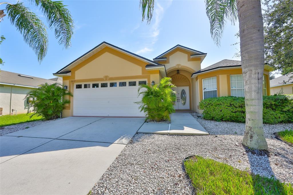 2613 Thames River Place Valrico, FL 33596 - Photo 1 of 41 a view of a house with a yard and potted plants