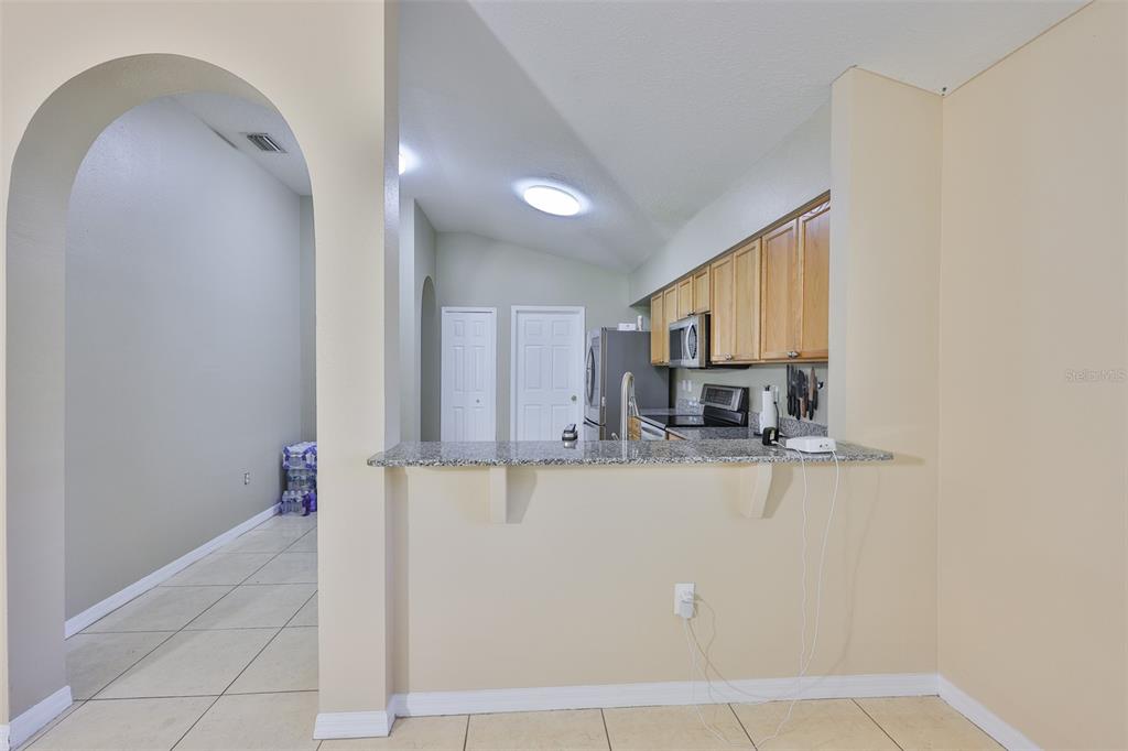 2613 Thames River Place Valrico, FL 33596 - Photo 11 of 41 a kitchen with stainless steel appliances granite countertop a sink and cabinets