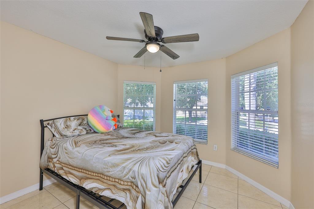 2613 Thames River Place Valrico, FL 33596 - Photo 23 of 41 a bedroom with a bed and window
