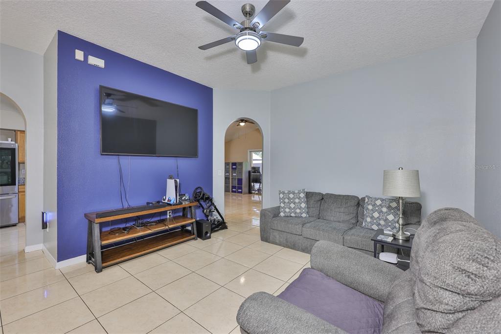 2613 Thames River Place Valrico, FL 33596 - Photo 9 of 41 a living room with furniture and a flat screen tv