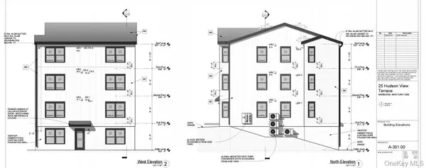 a view of a white building with glass windows