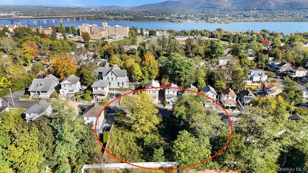an aerial view of residential house with outdoor space and trees