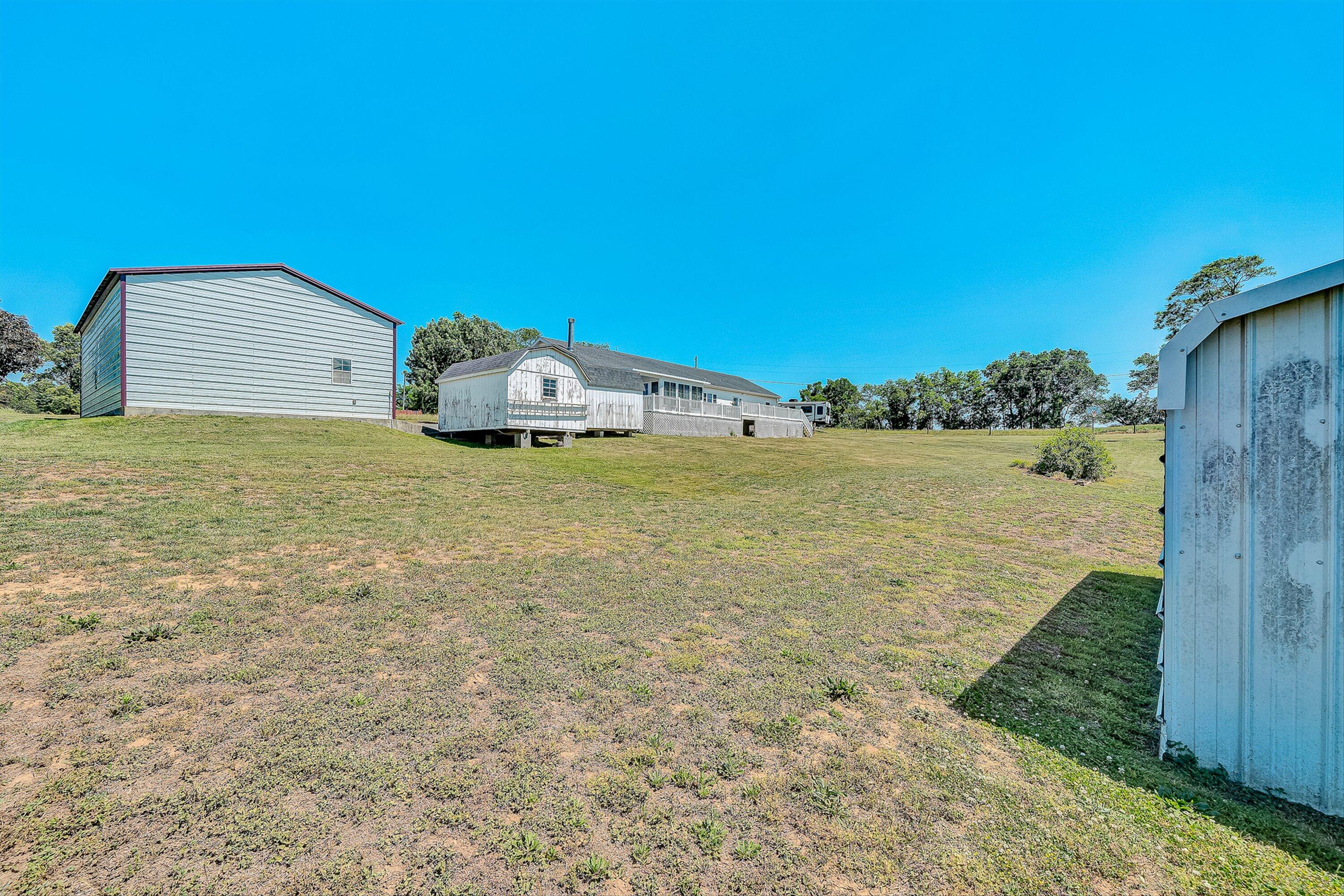 159 Simmons Creek Road Union Hall, VA 24176 - Photo 47 of 55 a view of a big yard with an outdoor seating