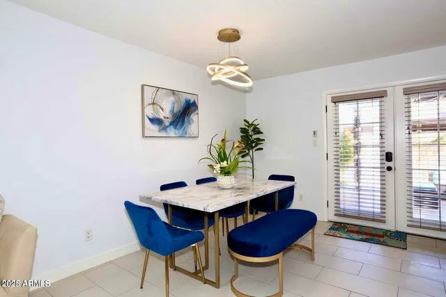 a dining room with furniture and window
