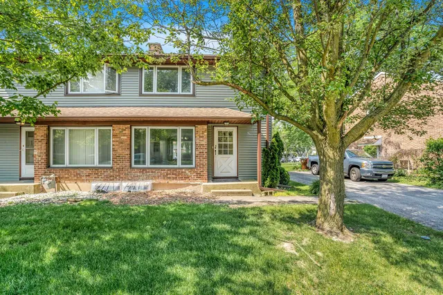 front view of a house with a yard