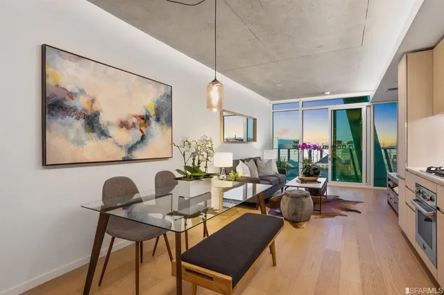 a living room with furniture and flowers