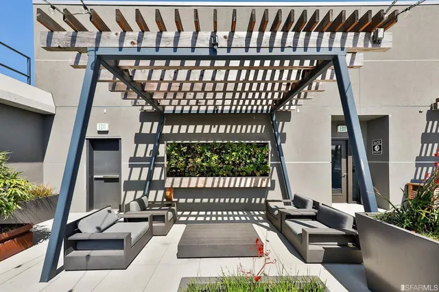 a view of a terrace with couches and pool
