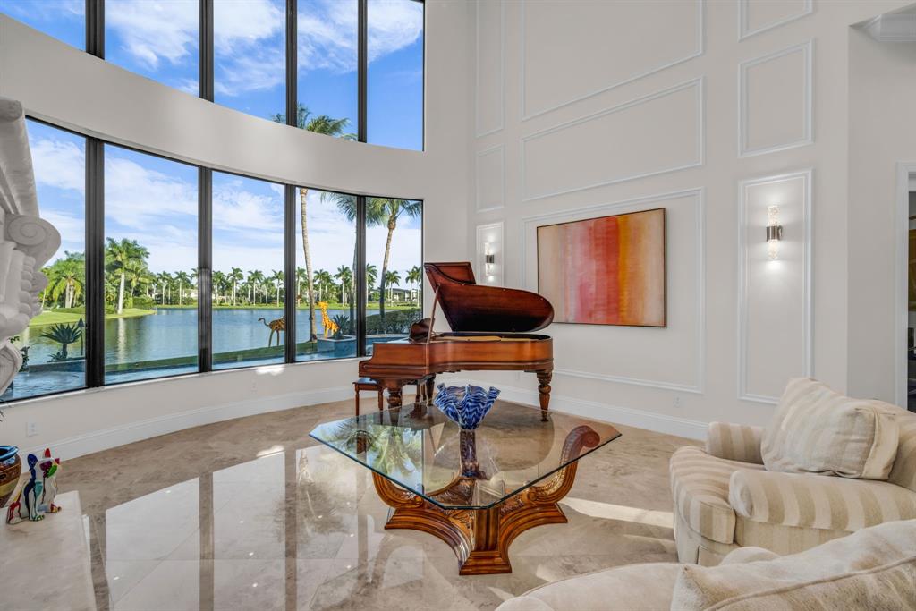 7328 Ballantrae Court Boca Raton, FL 33496 - Photo 20 of 89 a living room with furniture and a floor to ceiling window