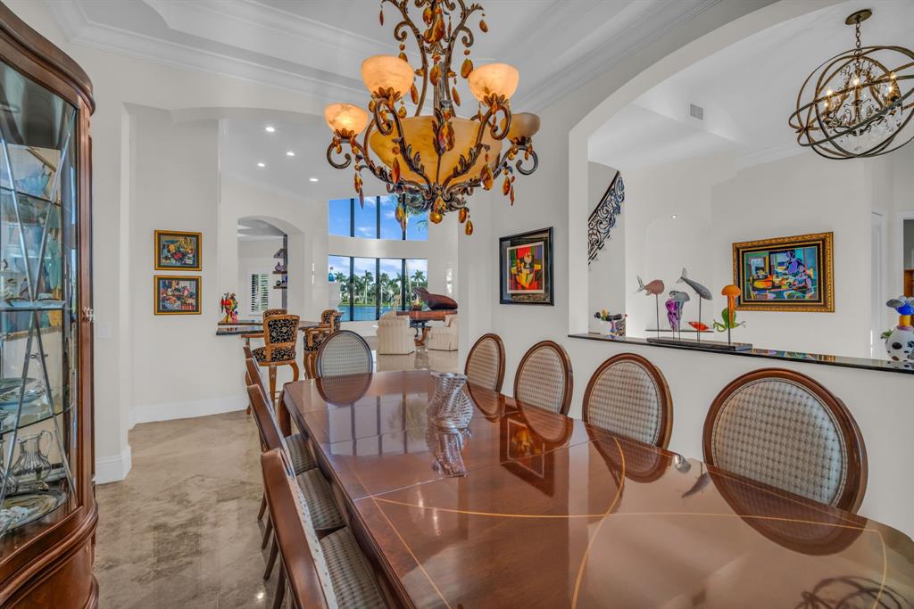 7328 Ballantrae Court Boca Raton, FL 33496 - Photo 25 of 89 a view of a dining room with furniture and chandelier