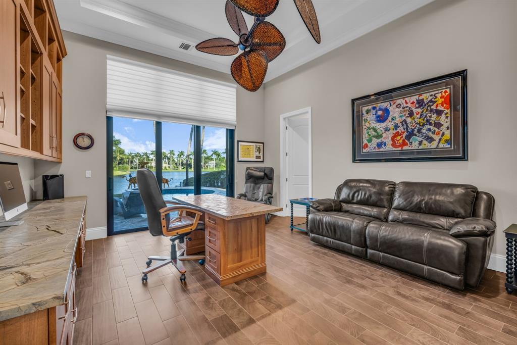7328 Ballantrae Court Boca Raton, FL 33496 - Photo 33 of 89 a living room with furniture and a floor to ceiling window