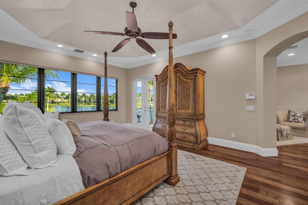 7328 Ballantrae Court Boca Raton, FL 33496 - Photo 35 of 89 a bed room with a bed and a walk in closet