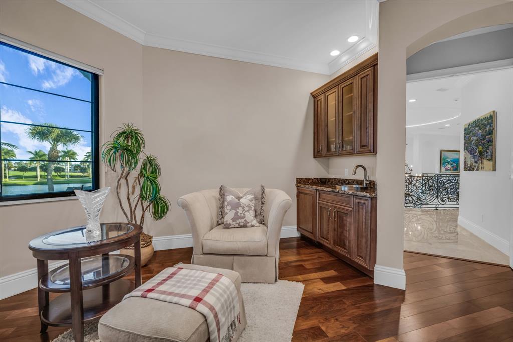 7328 Ballantrae Court Boca Raton, FL 33496 - Photo 38 of 89 a living room with furniture a wooden floor and a large window