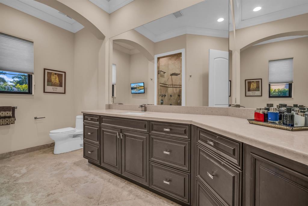 7328 Ballantrae Court Boca Raton, FL 33496 - Photo 40 of 89 a spacious bathroom with a sink double vanity and a toilet