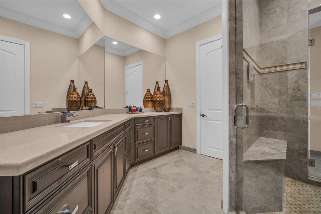7328 Ballantrae Court Boca Raton, FL 33496 - Photo 41 of 89 a spacious bathroom with a double vanity sink a mirror and a shower