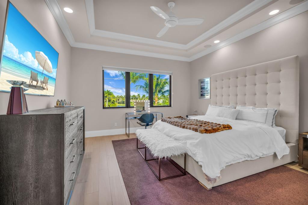 7328 Ballantrae Court Boca Raton, FL 33496 - Photo 47 of 89 a bedroom with a bed and a table in it