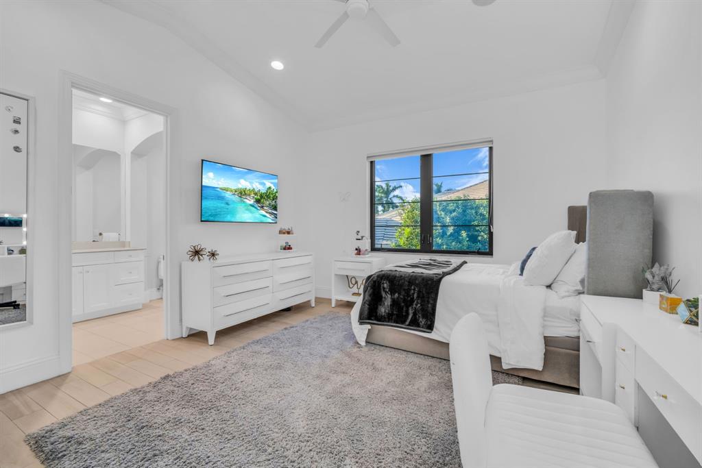 7328 Ballantrae Court Boca Raton, FL 33496 - Photo 49 of 89 a bed room with furniture and a window