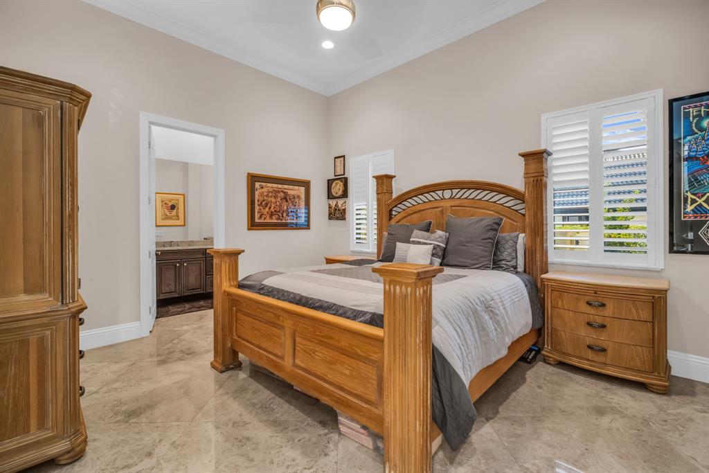 7328 Ballantrae Court Boca Raton, FL 33496 - Photo 51 of 89 a bedroom with a bed and a dresser