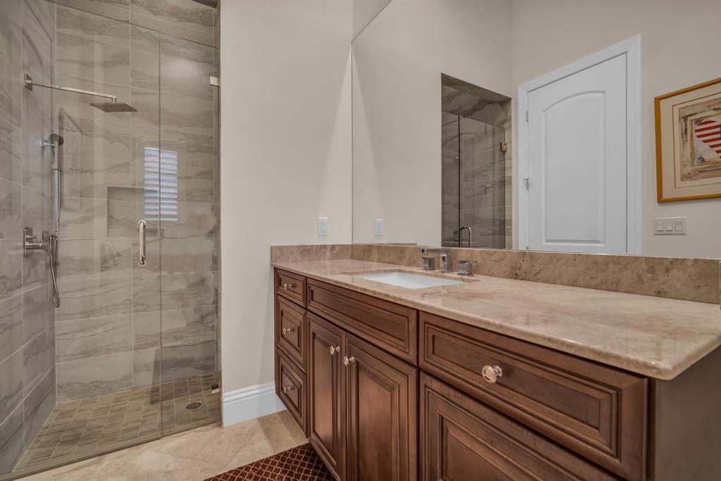 7328 Ballantrae Court Boca Raton, FL 33496 - Photo 52 of 89 a bathroom with a granite countertop sink a mirror and a shower