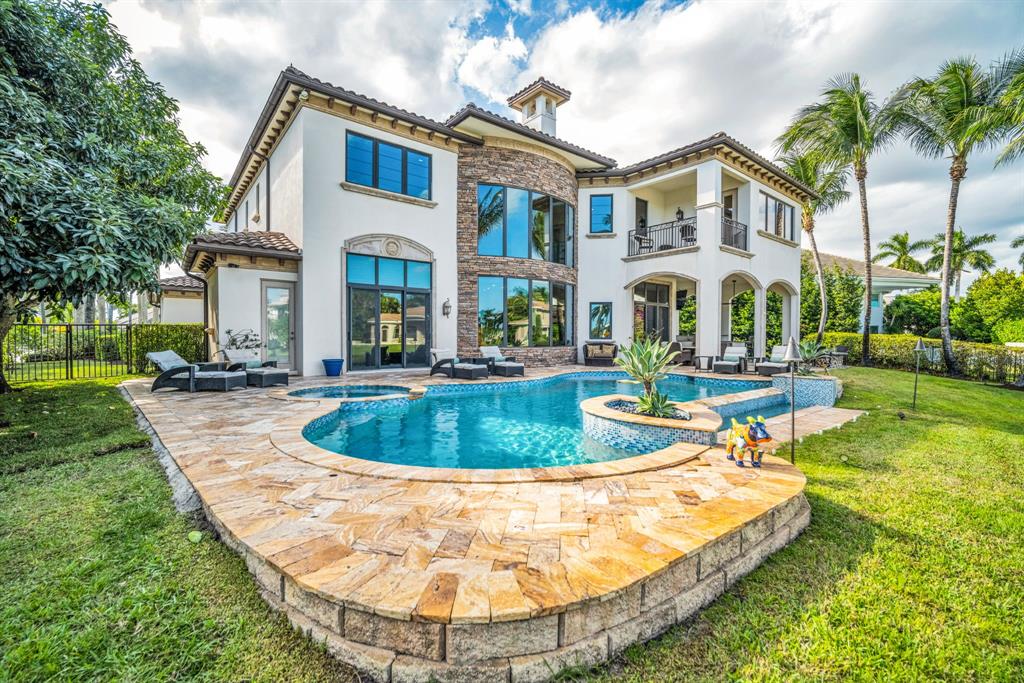 7328 Ballantrae Court Boca Raton, FL 33496 - Photo 70 of 89 a view of a house with swimming pool and a small yard