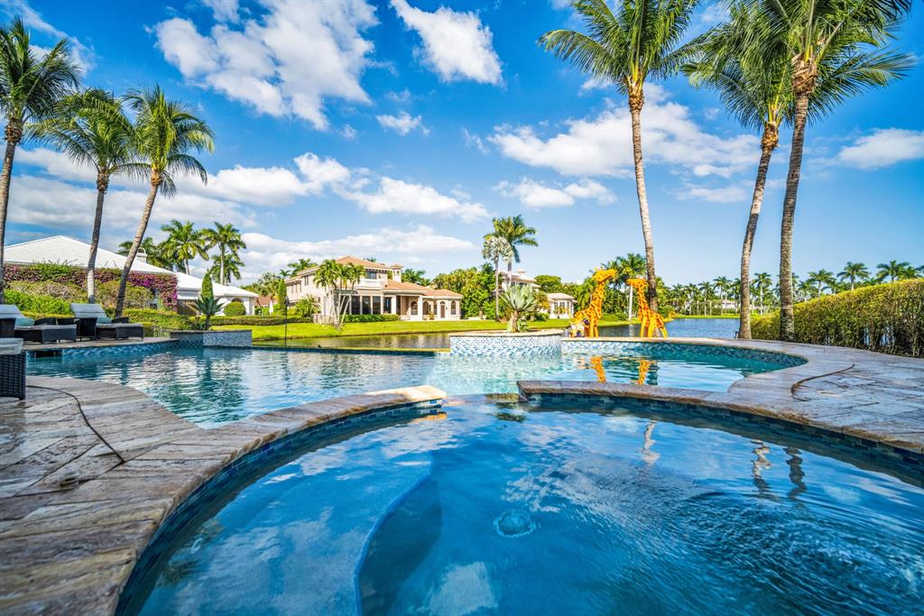 7328 Ballantrae Court Boca Raton, FL 33496 - Photo 84 of 89 a view of a lake with boats and palm trees