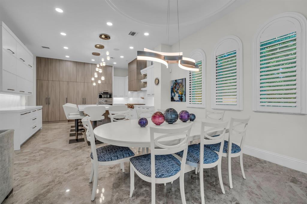7328 Ballantrae Court Boca Raton, FL 33496 - Photo 10 of 89 a view of a dining room with furniture and wooden floor