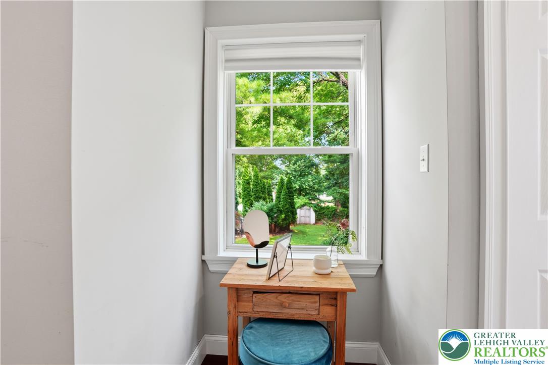 2014 Linden Street Bethlehem, PA 18017 - Photo 49 of 85 A window frames vibrant garden views, creating a serene and private atmosphere.