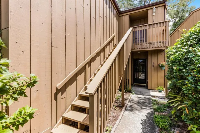 a view of entryway with flower pots and wooden floor